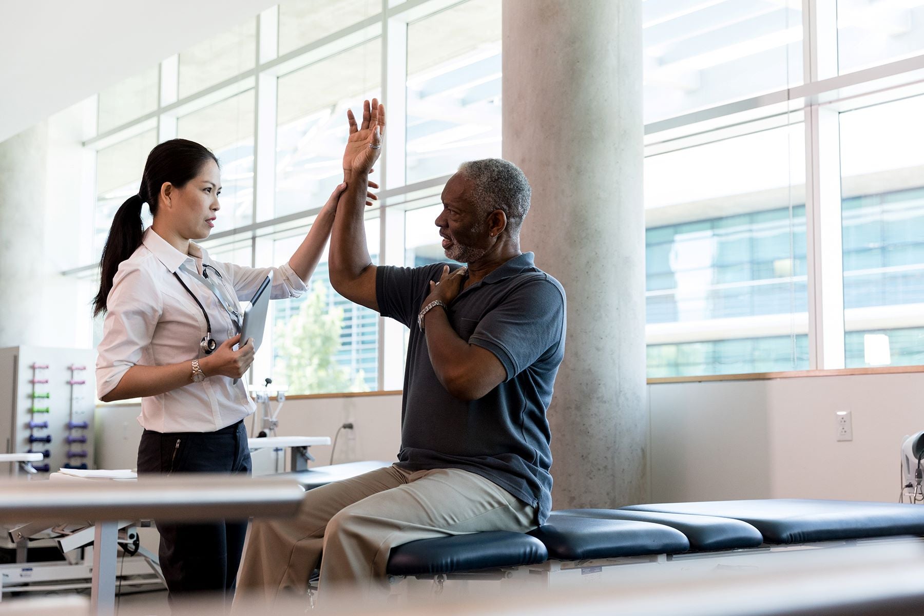 Nurse and patient high fiving