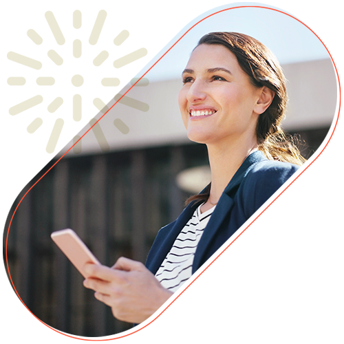 Woman smiling with a phone in hand