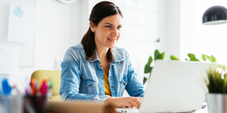 Woman on laptop smiling