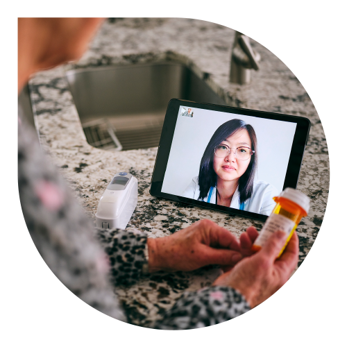 doctor on tablet smiling