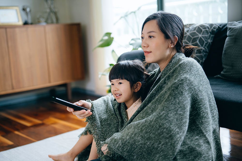 Mother and daughter watching tv