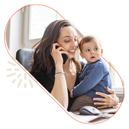 Mom on the phone while holding child