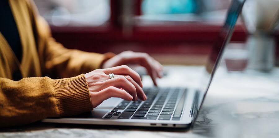 Person typing on laptop