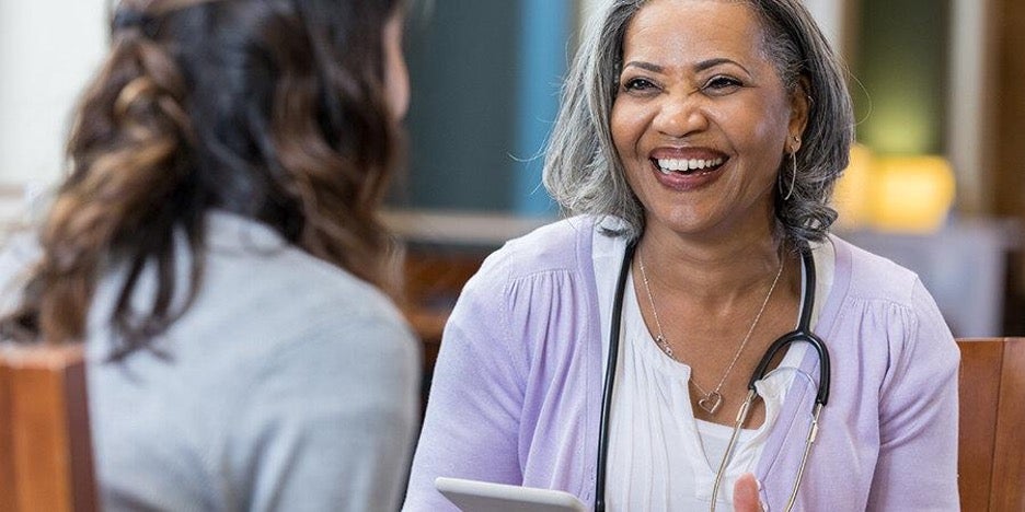 Nurse speaking with a patient