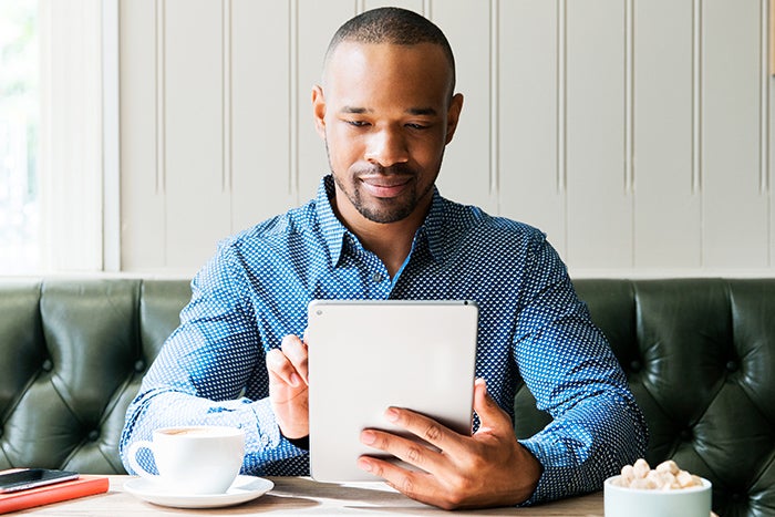 Man reading tablet