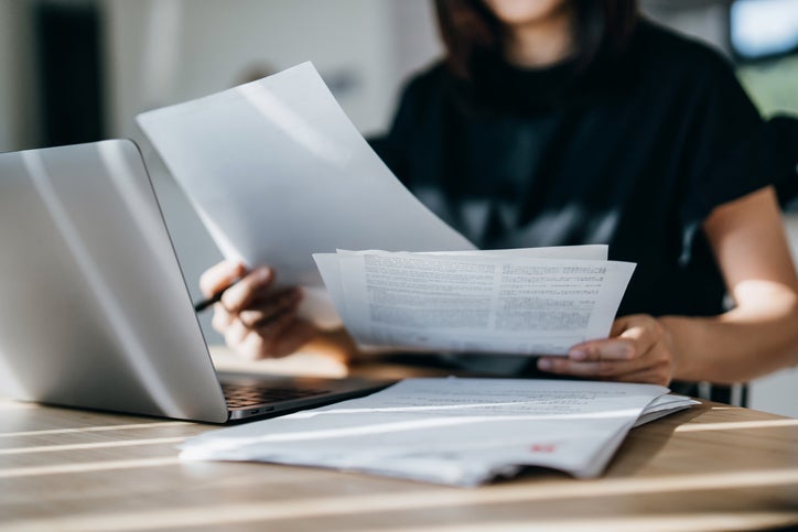 person looking at paperwork