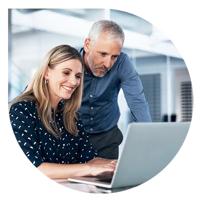 Two people looking at computer