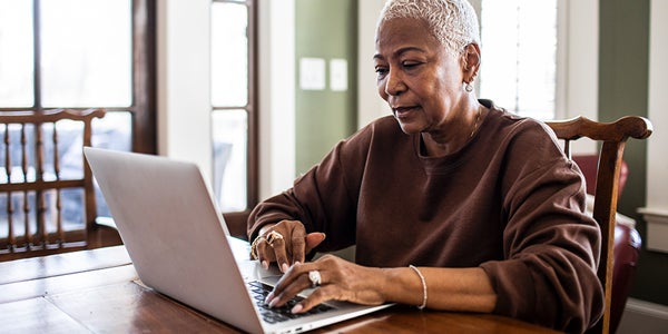 Older woman looking at a laptop