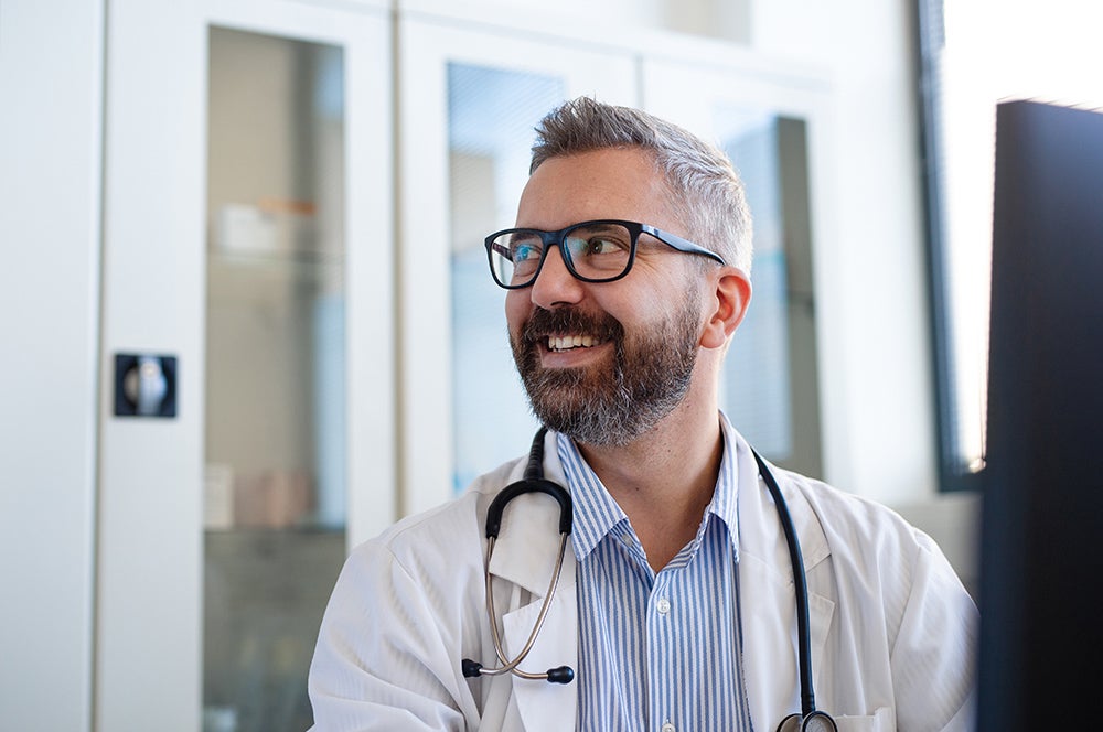 Doctor looking off camera smiling 