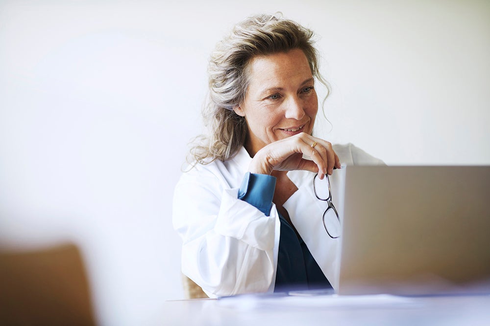 Female doctor looking at computer 
