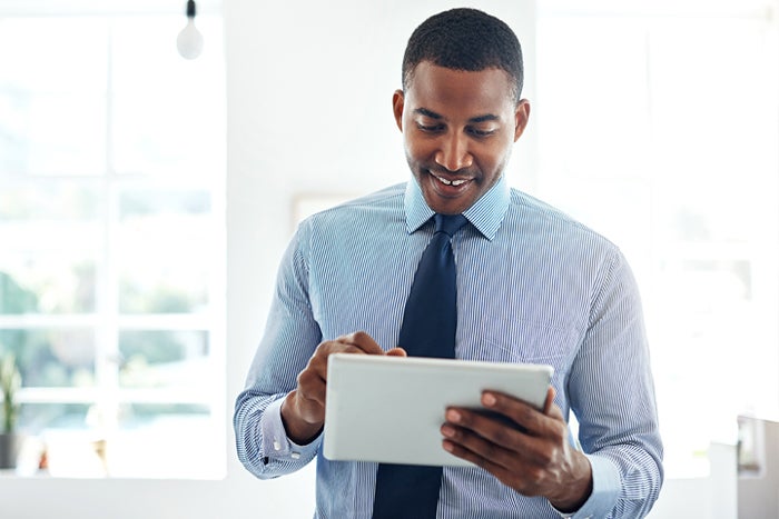 Man looking at ipad