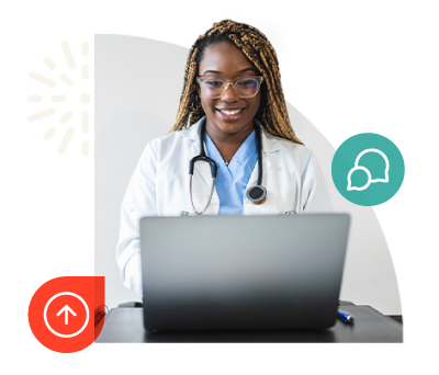 Female doctor smiling at computer
