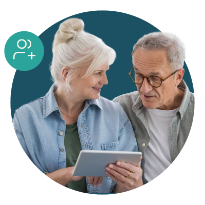 Elderly couple using a tablet.