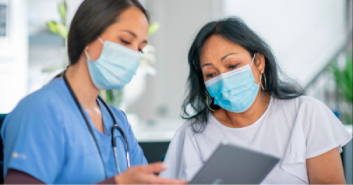 Doctor going over information with a patient