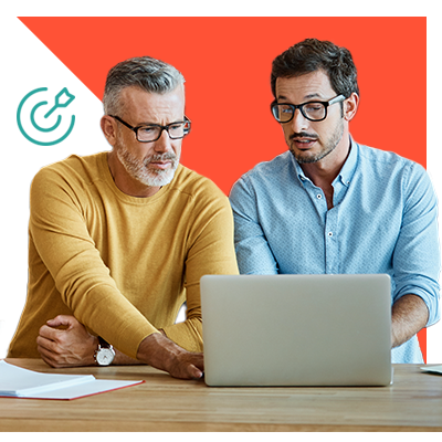 Two men working on a computer together