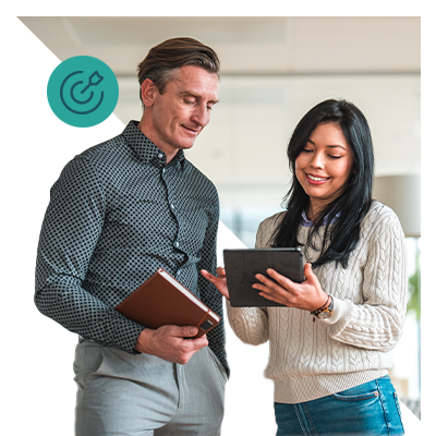man and woman looking at an ipad