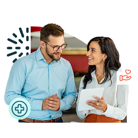 Two people talking looking at ipad